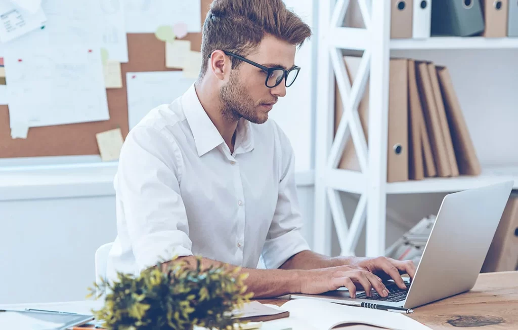 A young man focusing on his work.