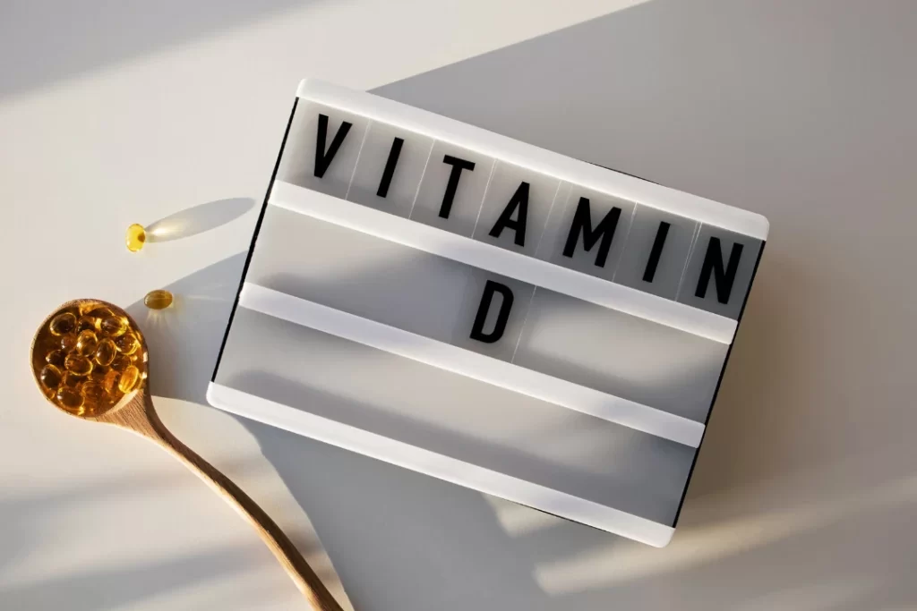 Vitamin D3 Supplements in wooden spoon