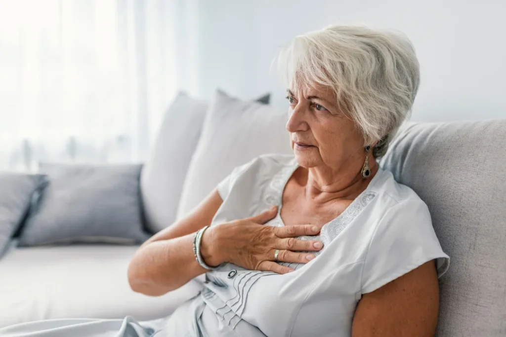 Old woman feeling pain in the heart. 