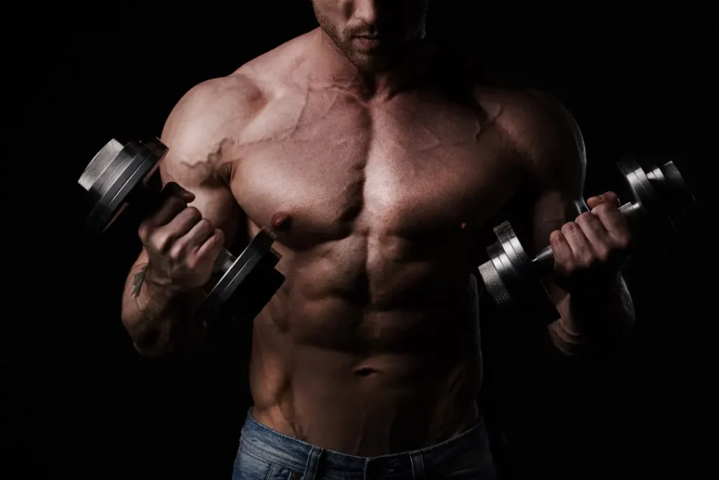 Bodybuilder with heavy weights in hand. 