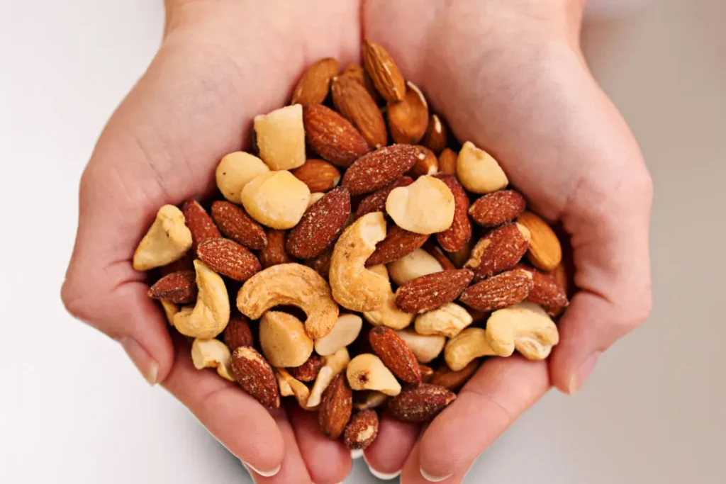 nuts closeup shoot in hand Nature's garden keto snack mix