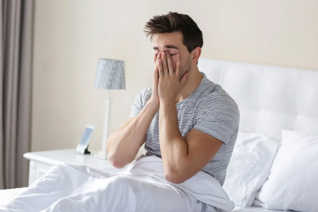 A man feeling tired in the morning.