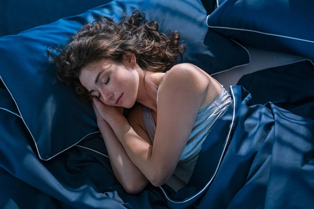women sleeping on a bed