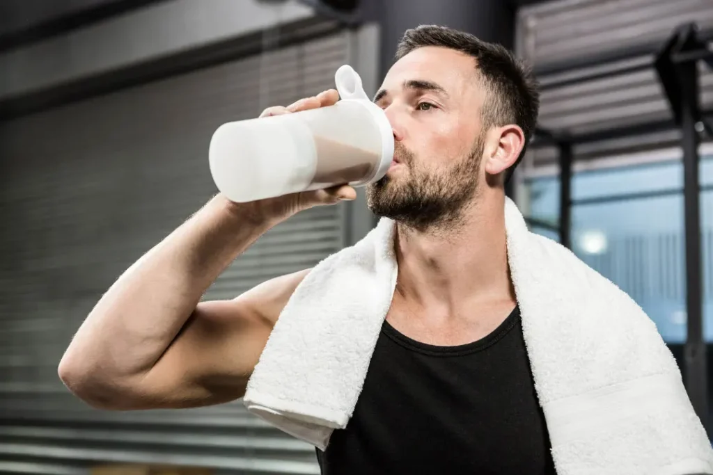 Man drinking protein shake. 
