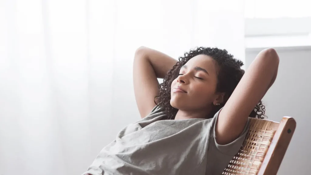 Girl sitting on a chair.