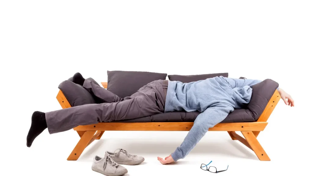 Man sleeping on a couch. 