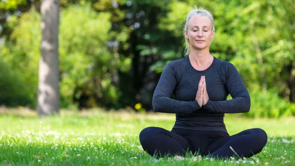 A healthy woman doing yoga for better focus and mental health